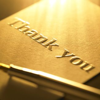 thank you card with pen in sunlight
