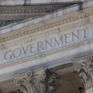the word 'government' etched on side of stone building